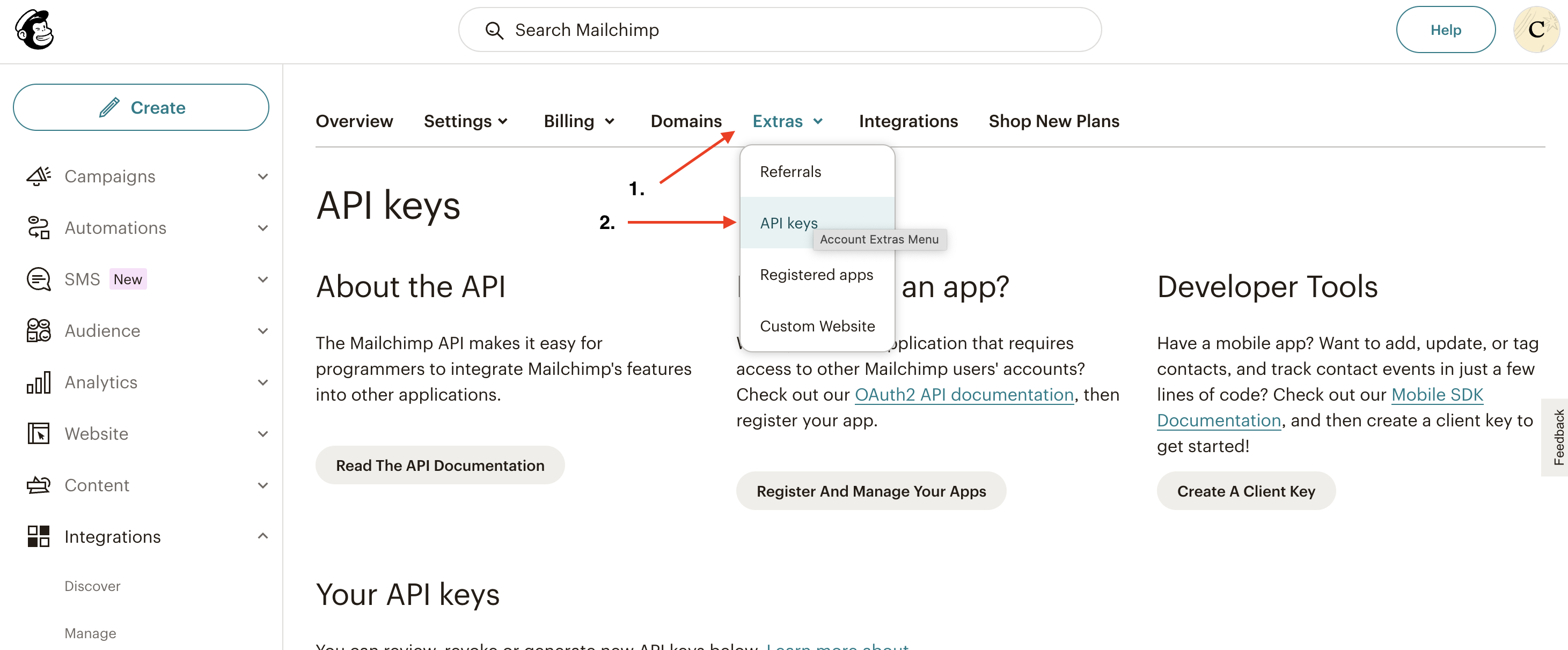 Screenshot of MailChimp dashboard with arrows pointing at the Extras tab and the API Keys section